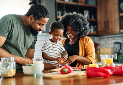 child family kitchen food boy son mother father breakfast preparing egg morning healthy diet eating home black african american father cooking, parent, cute, meal