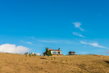 House on top of a hill against blue sky, with copy space - Sao Francisco de Paula, Brazil