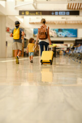 Mother and kids in airport