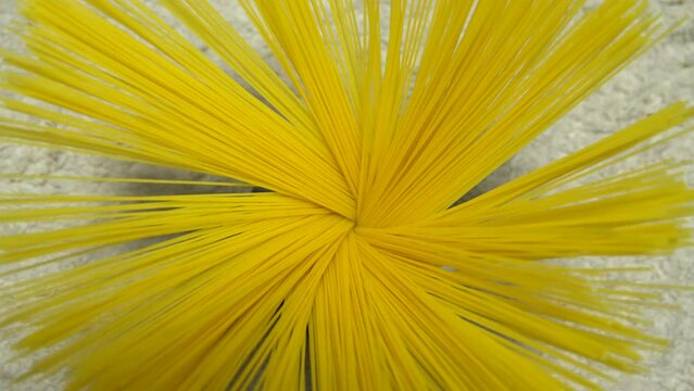 Top view A pack of uncooked spaghetti abstract background of spaghetti pasta rotating close up