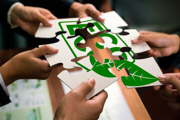 Cohesive group of business people forming jigsaw puzzle pieces in environmental awareness symbol as...