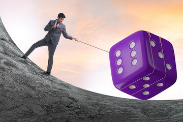 Uncertainty concept with businessman and dice