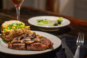 T bone steak dinner with sides.