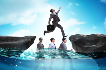Inequal competition concept with businessman walking on heads