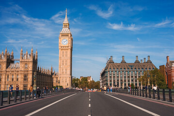 Big Ben, Westminster Bridge on River Thames in London, the UK. English symbol. Lovely puffy clouds, sunny day