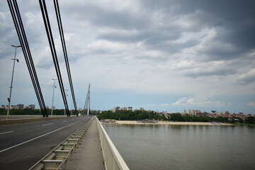 Novi Sad, Serbia - 07 30 2023: Štrand beach on Danube River shot from bridge on a cloudy day landscape