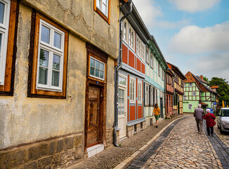 Fototapeta na wymiar small town with old vintage small colored houses and old cobblestone pavement