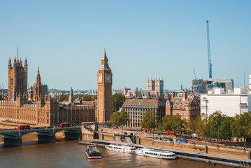 Big Ben, Westminster Bridge on River Thames in London, the UK. English symbol. Lovely puffy clouds,...