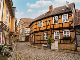 small town with old vintage small colored houses and old cobblestone pavement