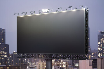 Blank black horizontal billboard on cityscape background at night, perspective view. Mockup, advertising concept