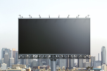 Blank black horizontal billboard on city buildings background, front view. Mockup, advertising concept