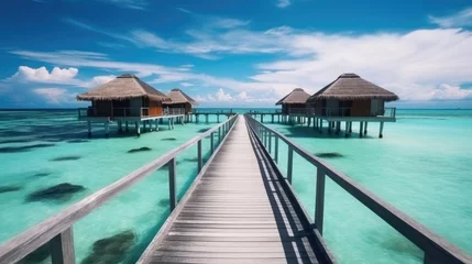 Fotobehang Luxury water villas resort and wooden pier, Summer vacation holiday and travel concept, Vacation. © visoot