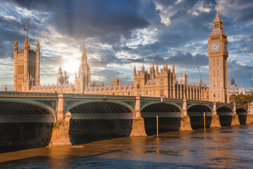 Big Ben, Westminster Bridge on River Thames in London, the UK. English symbol. Lovely puffy clouds, sunny day