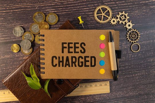 FEES CHARGED text on notebook with clipboard and calculator on chart background - Powered by Adobe