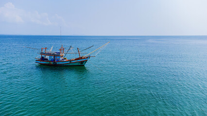 A small fishing boat floating in the sea