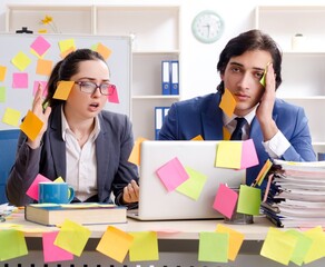 Two colleagues employees working in the office