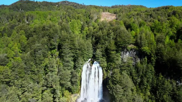 Dron view of waterfall near heart shape lagoon Laguna corazon in Chile. Waterfall near Lican Ray