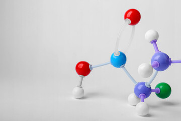 Structure of molecule on white background, closeup. Chemical model