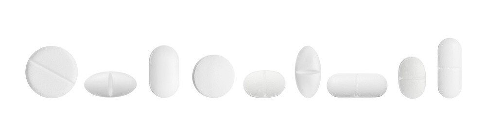 Set of different pills in row isolated on white