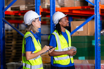 Group worker warehouse working brainstorm checklist product to shelf in warehouse store. Logistics factory industry supervisor manufacture. business logistics and transport.