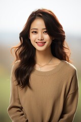 Fototapeta premium portrait of a young Asian woman in a minimal outfit with a beautiful smile.