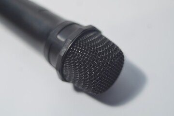 Selective focus microphone isolated on white background