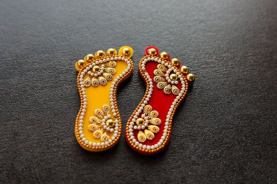 Dhanteras goddess golden feet. Thali for festival celebration to worship. Laxmi Charan Paduka Diwali festival celebration background. Maa Lakshmi footprint Hindu Pooja Material.