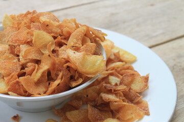 French fries in plate and bowl on table