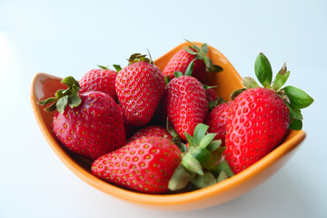  Ripe Red Strawberries in a bowl on table 