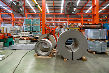 An industrial setting filled with neatly Steel sheet roll stack, reflecting the industry's...
