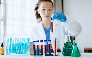 Modern medical research laboratory. female scientist working with micro pipettes analyzing...