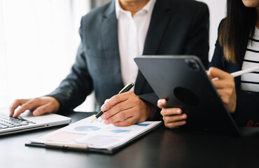 Business team meeting. professional investor working new start up project. Finance task. with smart phone and laptop and digital tablet computer  in morning light.