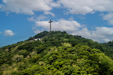 A large memorial cross, part of Mount Samat National Shrine, a historical shrine located near the...