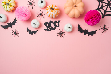 Halloween party concept. Pumpkin and decorations on trendy pink background. Top view, flat lay
