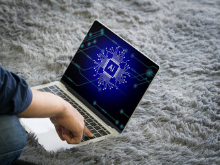 An individual engaged in work on a laptop, distinguished by a clearly visible AI cryptographic symbol.