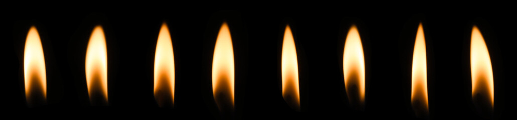 candle flame close up on dark background Melted wax candles that burn at night white candle burning in the dark candlelight	
