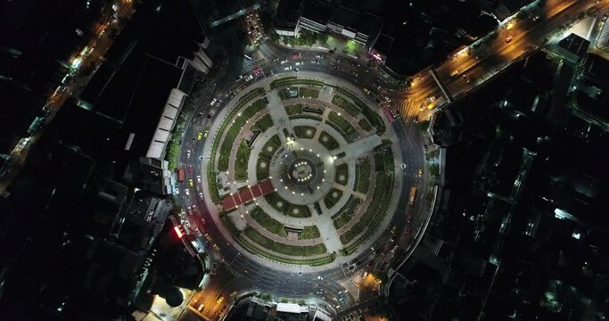 Aerial view night circular roundabout junction road with vehicle movement transport industry