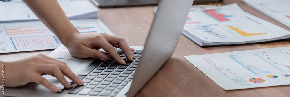 Poster Panorama shot analyst team utilizing BI Fintech to analyze financial report with laptop. Businesspeople analyzing BI power dashboard displayed on laptop screen for business insight. Scrutinize