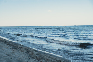 Baltic sea Dark blue clouds and sea or ocean water surface with foam waves before storm, dramatic seascape background. Incredible sunsets. Abstract natural pattern texture.