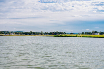 Equipped beach for relaxation and swimming near the lake in summer