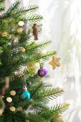 the decoration is hanging on the Christmas tree