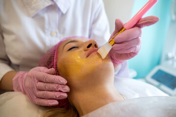  girl in a medical spa came for chemical peeling of the body and cosmetic treatment of acne.