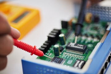 Closeup, motherboard and engineer solder circuit board for technology, electrical hardware or CPU...
