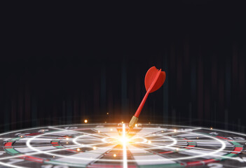 red dart aiming precisely at the center of the target board.	
