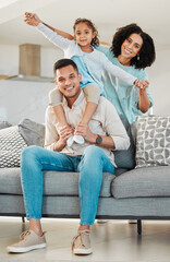 Portrait, smile and family on sofa in home living room, bonding and relax together. Interracial, happy and father, mother and child, girl or kid in piggyback, play game and quality time in house.