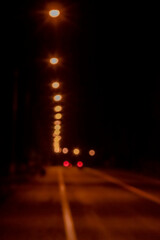 bokeh background of the lamps and street  light in the night out of focus