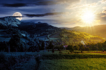 summer rural landscape with sun and moon at twilight. village in the valley, haystacks near forest....