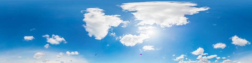 blue sky panorama with puffy clouds, for compositing in 3D graphics and aerial spherical panoramas as a sky dome