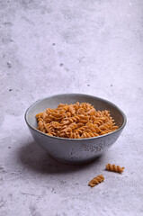 Dry dark brown pasta