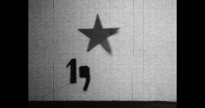 1986s year numbers moving stop motion figures, soviet star. Figure symbol move in cinema movie. Patterns with new year sign Archival vintage black white film. Archive video. Old retro 1980s Russia